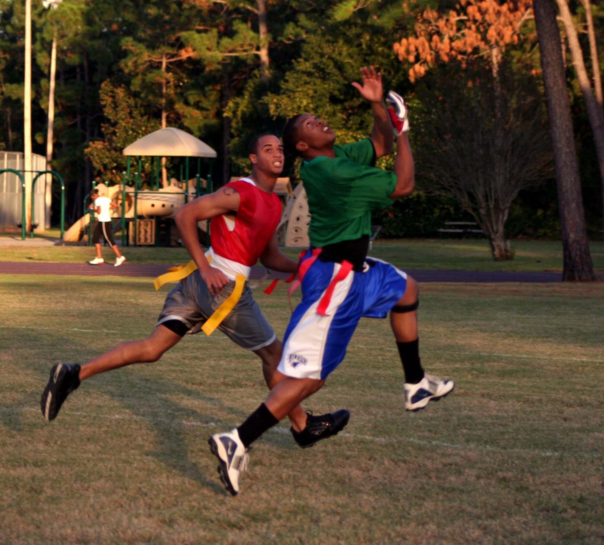 Evan Hunt (right), 16th Security Forces Squadron, prepares to intercept the ball during the HMXS flag football team’s opening drive  Oct. 24. SFS won the game, 34 – 18. (U.S. Air Force Photograph by Dylan Laurie)