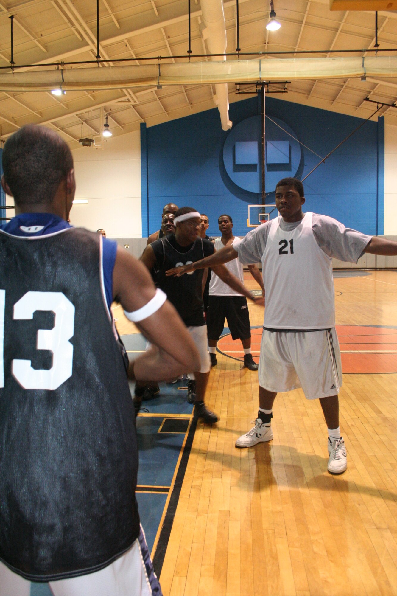 DeAngelo Gilliam, left, 505th Training Squadron, calls a play while Alfonso Porter, 16th Equipment Maintenance Squadron, number 21, defends during the men’s varsity basketball team practice at the Aderholt Fitness Center Oct. 19. (U.S. Air Force Photograph by Staff Sgt. Mareshah Haynes)