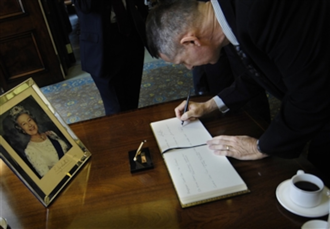 Chairman of the Joint Chiefs of Staff Marine Gen. Peter Pace signs a guestbook at the Royal College of Defense Studies prior to beginning a lecture with the faculty and student body in London, Oct. 26, 2006.
