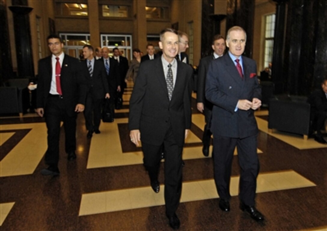 Chairman of the Joint Chiefs of Staff Marine Gen. Peter Pace and Air Chief Marshal Sir Jock Stirrup, walk to a meeting at the British Ministry of Defense, Oct. 26, 2006. 