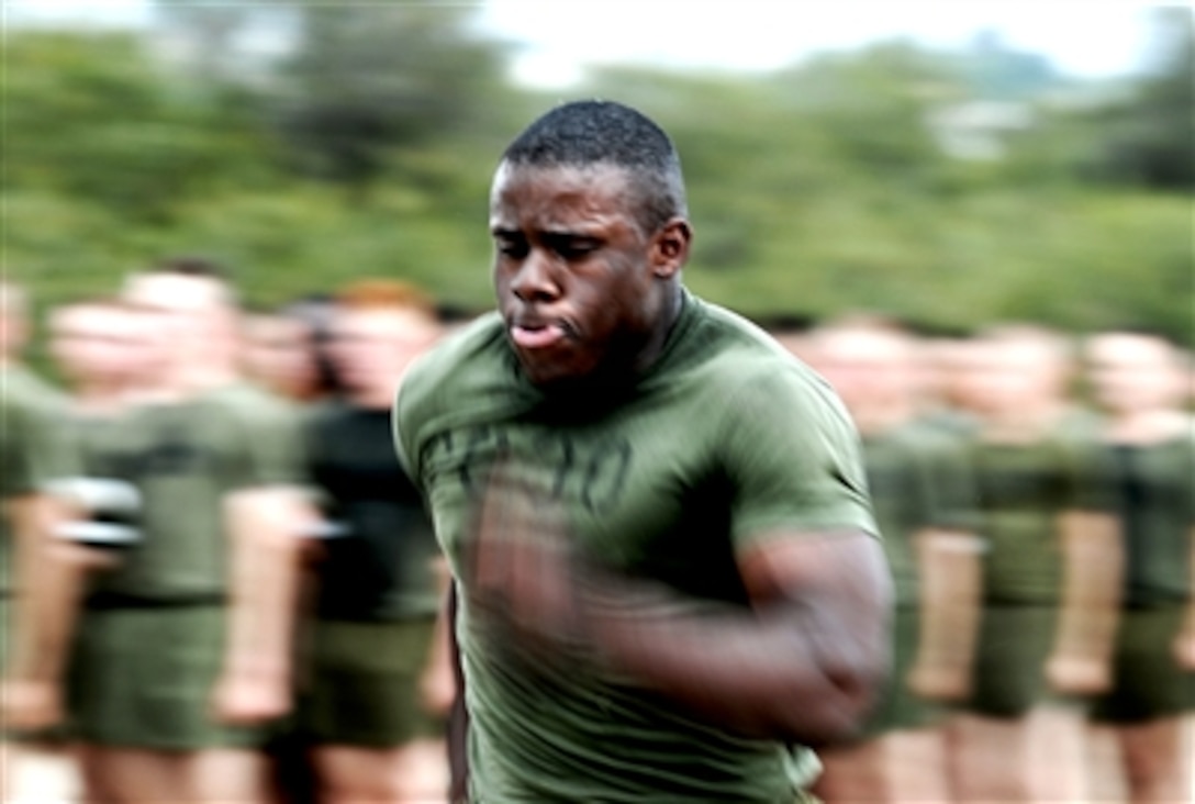 U.S. Marine Corps Pfc. Charles E. Warren, Platoon 2030, Company E, sprints to the finish line upon the completion of the 2.5-mile Strength and Endurance Course at Marine Corps Recruit Depot San Diego, Oct. 26, 2006. 