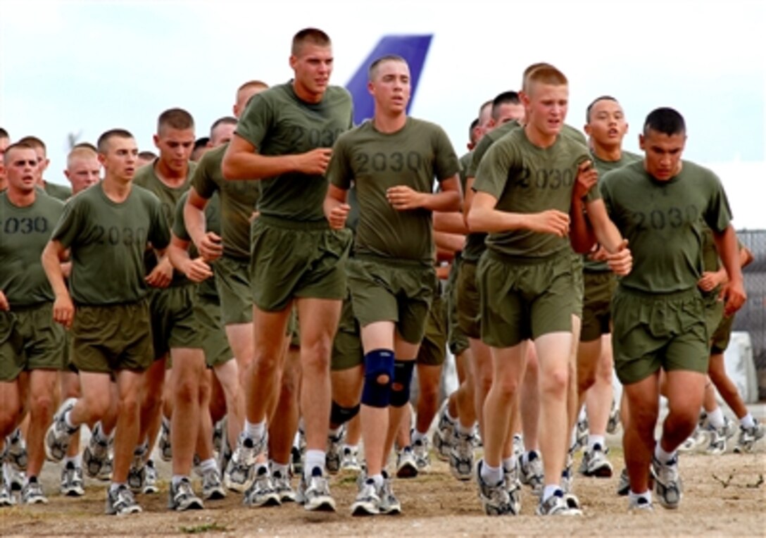 Marine recruits run a total of 2.5 miles during the Strength and Endurance Course before sprinting to the finish at Marine Corps Recruit Depot San Diego, Oct. 26, 2006.
