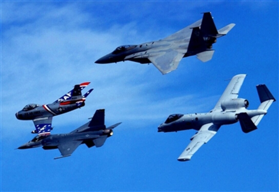 U.S. Air Force Heritage Fly-By performs a formation flight with an A-10 Thunderbolt II, F-15 Eagle, F-16 Falcon and F-86 Sabrejet during the practice air show at Naval Air Station Jax, Oct. 27.                                                                                                                                  