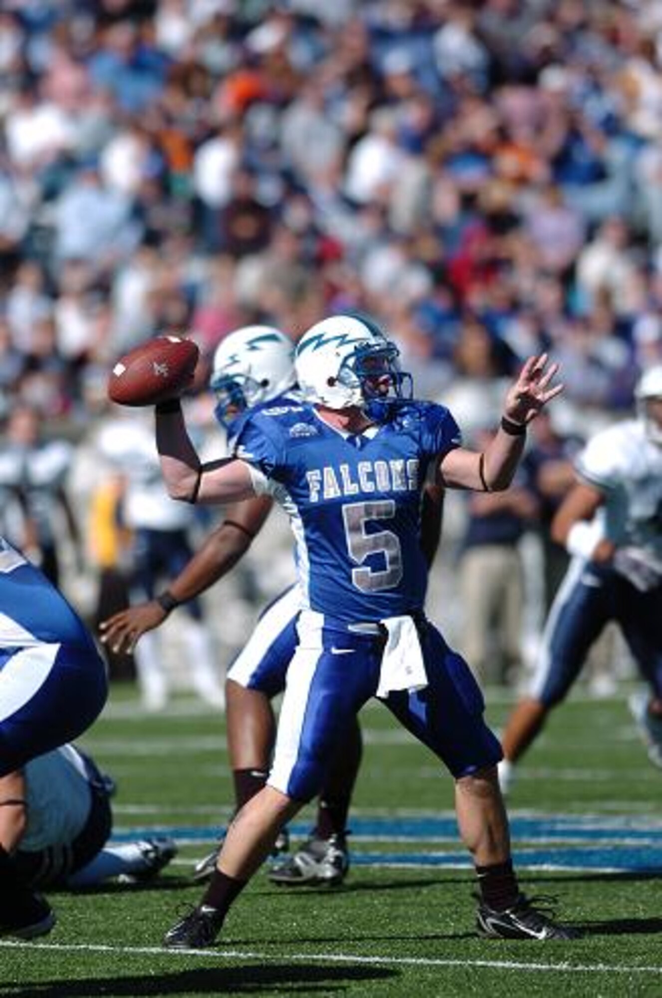 Falcon quarterback Shaun Carney throws downfield for 12 yards and a first down early in Air Force's game against BYU Saturday. Carney threw six times on the day, completing two passes for 16 yards and throwing one interception. BYU quarterback John Beck completed 23 passes on 31 attempts for 258 yards and three touchdowns.  BYU won, 33-14. (U.S. Air Force Photo/1st Lt. John Ross)