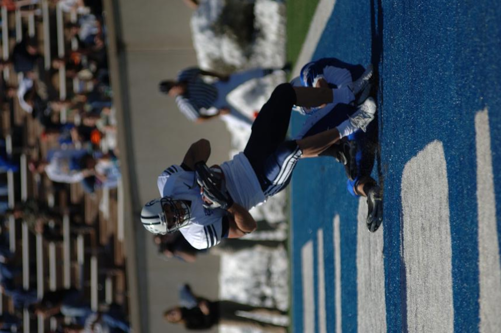 BYU tight end Jonny Harline pulls down a second-quarter touchdown from quarterback John Beck to put the Cougars ahead by 14 points. Beck threw for 258 yards, while two Air Force quarterbacks combined for 39 total pass yards. BYU won, 33-14. (U.S. Air Force Photo/1st Lt. John Ross)

