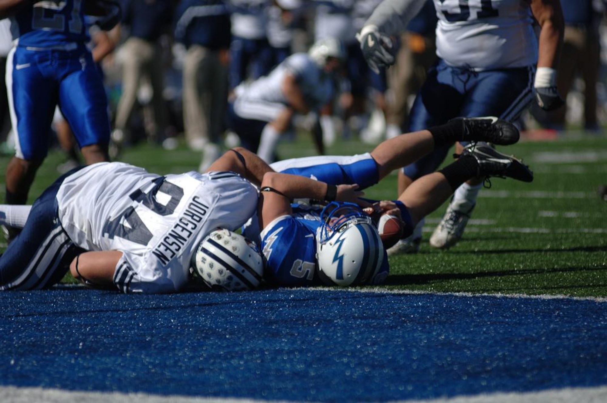 BYU defensive lineman Jan Jorgensen sacks Falcon quarterback Shaun Carney near the Air Force goal line to stifle hopes of a second-half comeback for the Falcons. Two Air Force quarterbacks combined for 39 total pass yards as BYU proved too strong for the Falcons, 33-14. (U.S. Air Force Photo/1st Lt. John Ross)