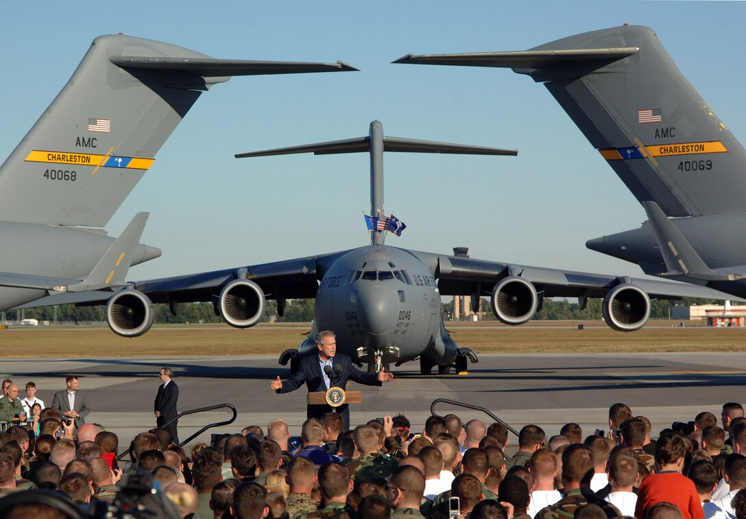 President George W. Bush delivers a speech in front of several C-17 Globemaster IIIs at Charleston Air Force Base, S.C., Oct. 28. More than four thousand servicemembers and families attended the presidential rally were he spoke on the war on terrorism. (U.S. Air Force photo/Tech. Sgt. Larry A. Simmons)