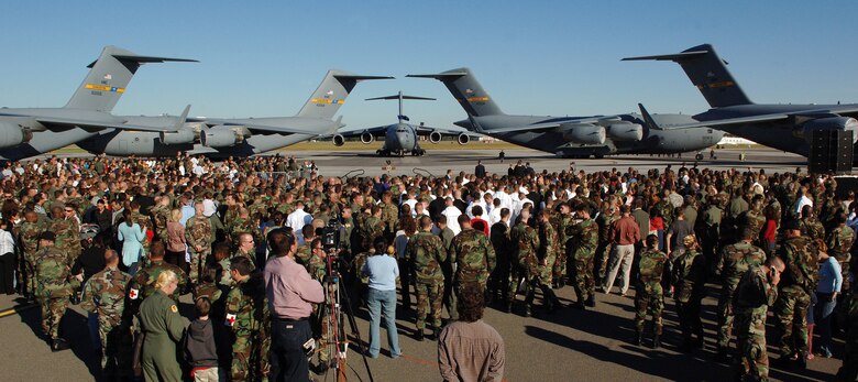 Airmen and relatives gather on the flight line moments before President George W. Bush delivers a speech at Charleston Air Force Base, S.C., Oct. 28. More than four thousand servicemembers and families attended the presidential rally were he spoke on the war on terrorism. (U.S. Air Force photo/Tech. Sgt. Larry A. Simmons) 