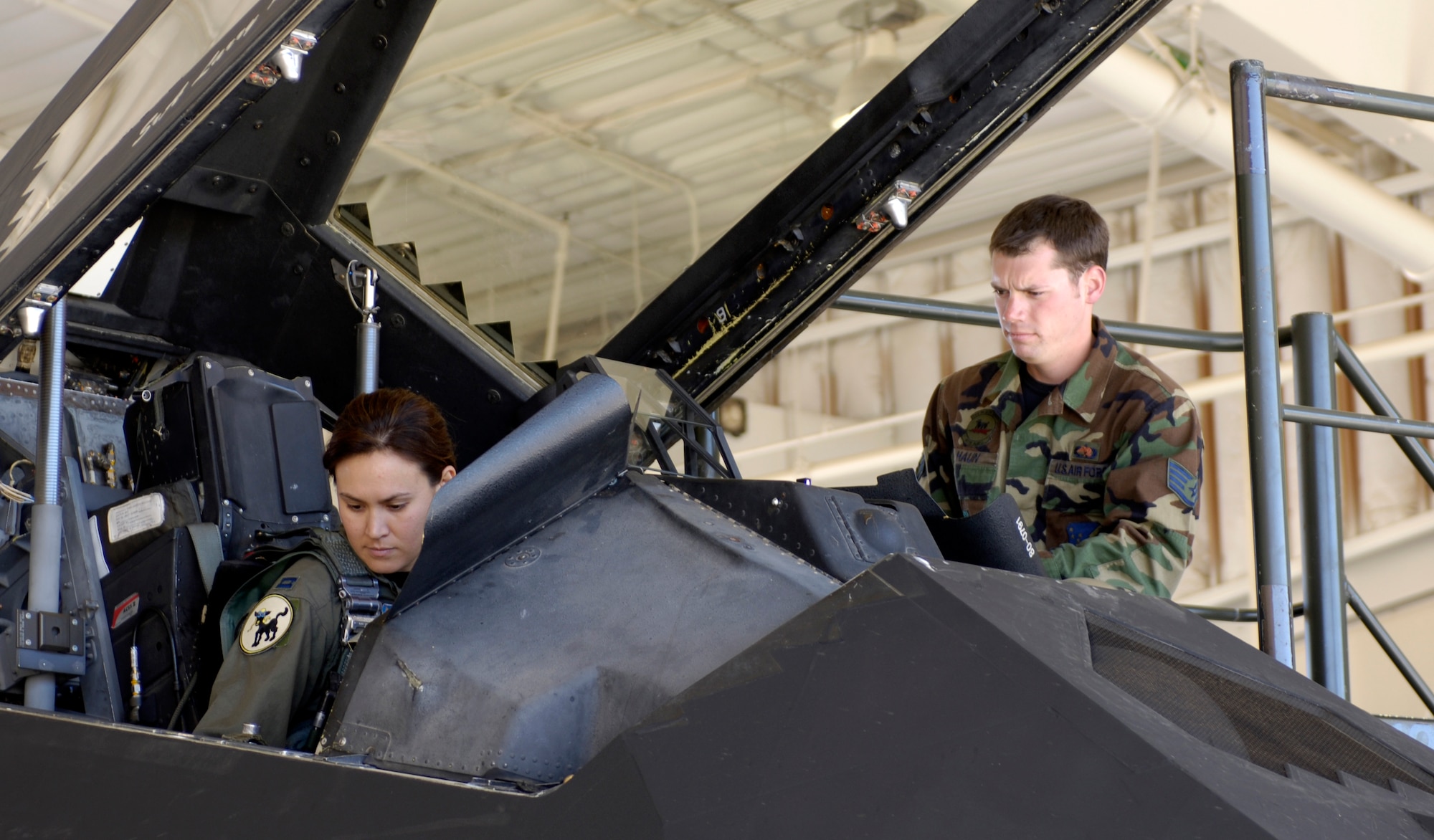 Capt. Christina Szasz prepares an F-117 Nighthawk for takeoff at Holloman Air Force Base, N.M. Oct. 27. The plane was part of a 25-plane formation celebrating the Nighthawk's 25th anniversary and 250,000 flying hour. The planes were separated into five groups and flew over the base to end the celebration ceremony. (U.S. Air Force photo/Senior Airman Brian Ferguson)