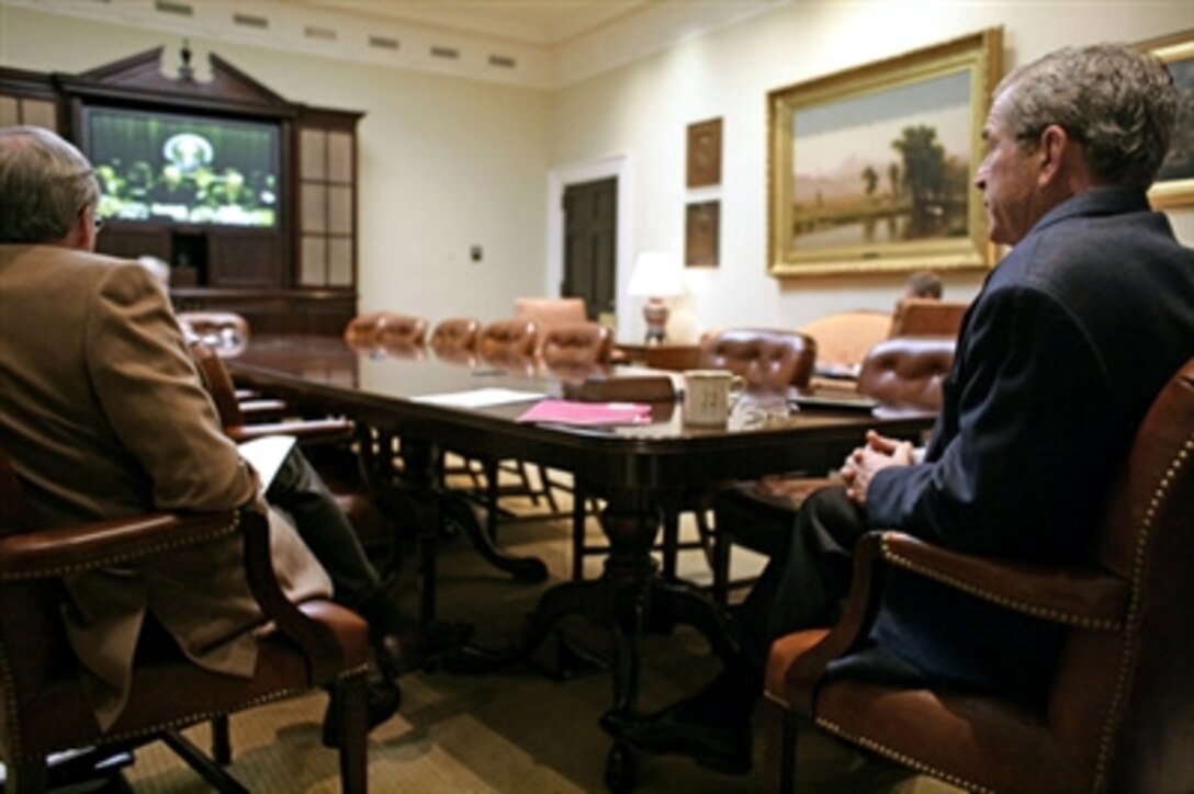In a video teleconference between the White House and Baghdad, President George W. Bush talks with Iraqi Prime Minister Nouri al-Maliki, Oct. 28, 2006. 