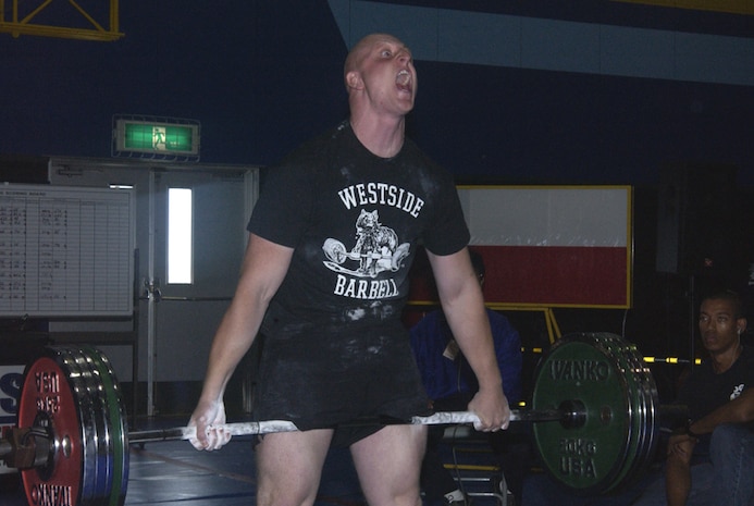 Bart C. Yager, native of Eustis, Fla., lets out an intense yell during his "money maker lift." Yager and 12 others competed in the Far East Powerlifting Championship at the IronWorks Gym, Oct. 29.