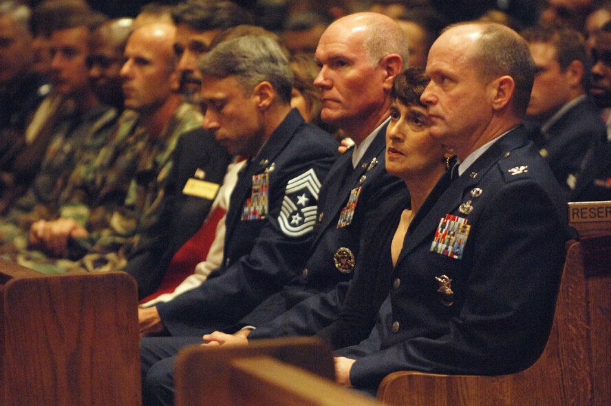 The commander of the 820th Security Forces Group, Col. John Decknick (right) and wife Sammie with Col. Joe Callahan, 23rd Wing commander and Chief Master Sgt. Michael Mazzi, 23rd Wing command chief, reflect during the memorial service for Airman 1st Class LeeBernard Chavis Oct. 19. Security force member Airman Chavis was killed Oct. 14 in the line of duty while on joint patrol with the Iraqi police in the vicinity of Baghdad, Iraq. (U.S. Air Force photo/Staff Sgt. Manuel Martinez)
