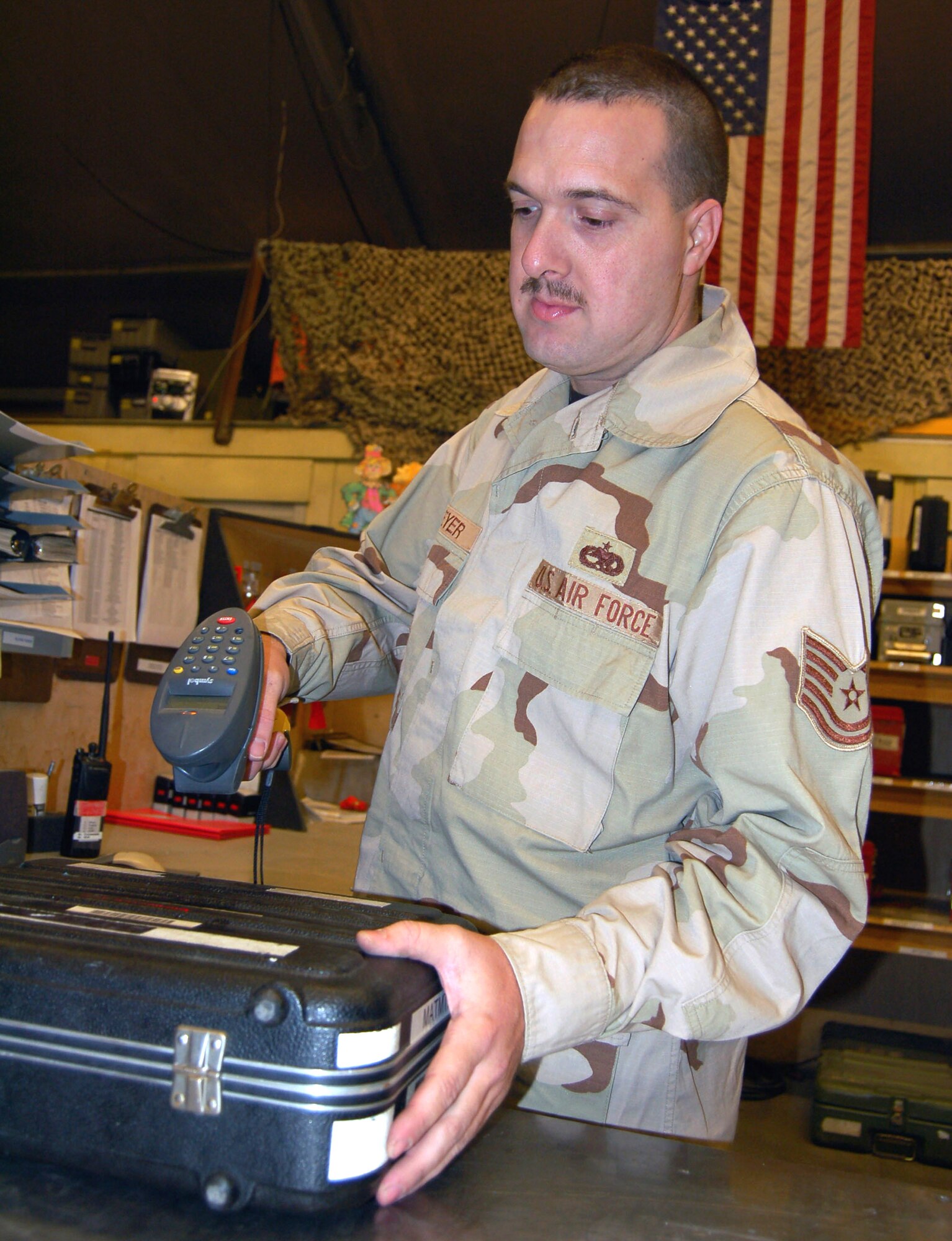 Tech. Sgt. Scott Meyer scans a kit to be used by the maintainers on the flightline. This scanning system helps the maintainers keep tool accountability and saves processing time. Sergeant Meyer is the KC-135 Aircraft Maintenance Unit support section NCO in charge and is deployed from the 92nd Aircraft Maintenance Squadron, Fairchild Air Force Base, Wash.  (U.S. Air Force photo/Master Sgt. Mitch Gettle)
