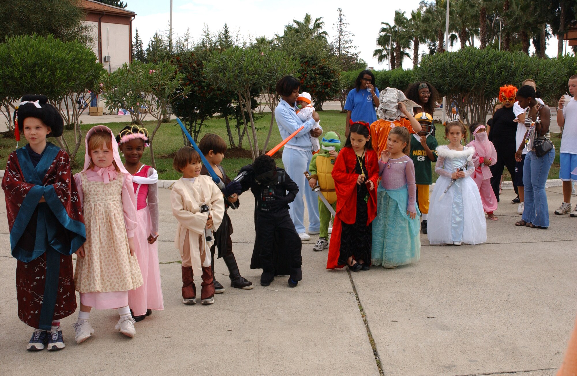 Children who participated in the costume contest at the fall carnival wait to hear who the winners are Oct 28. (U.S. Air Force photo by Airman 1st Class Tiffany Colburn)                