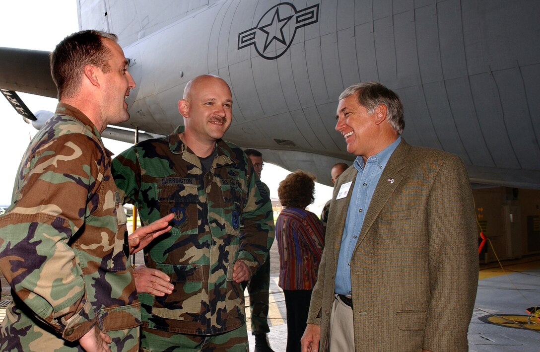 ROYAL AIR FORCE MILDENHALL, England - Maj. John Franklin, left, 100th Maintenance Squadron commander, and Master Sgt. Russell Carrington, center, 100th Maintenance Squadron, talk with Mr. Robert E. “Bob” Largent, chairman of the board, Air Force Sergeant’s Association, inside the fuel cell shop during a facility tour here, October 26, 2006. (US Air Force photo by Tech. Sgt. Jeanette Copeland)