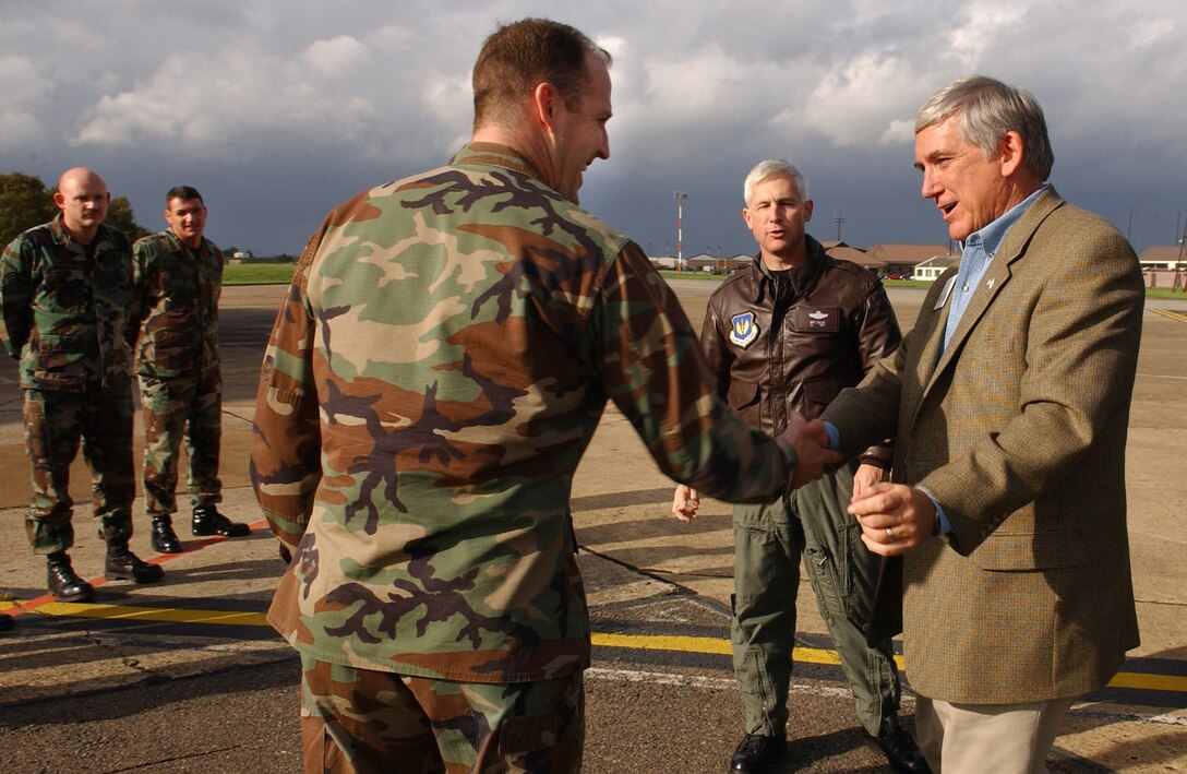 ROYAL AIR FORCE MILDENHALL, England - Maj. John Franklin, far left, 100th Maintenance Squadron commander, shakes hands with Mr. Robert E. “Bob” Largent, chairman of the board, Air Force Sergeant’s Association, outside the fuel cell shop during a facility tour here, October 26, 2006. (US Air Force photo by Tech. Sgt. Jeanette Copeland)