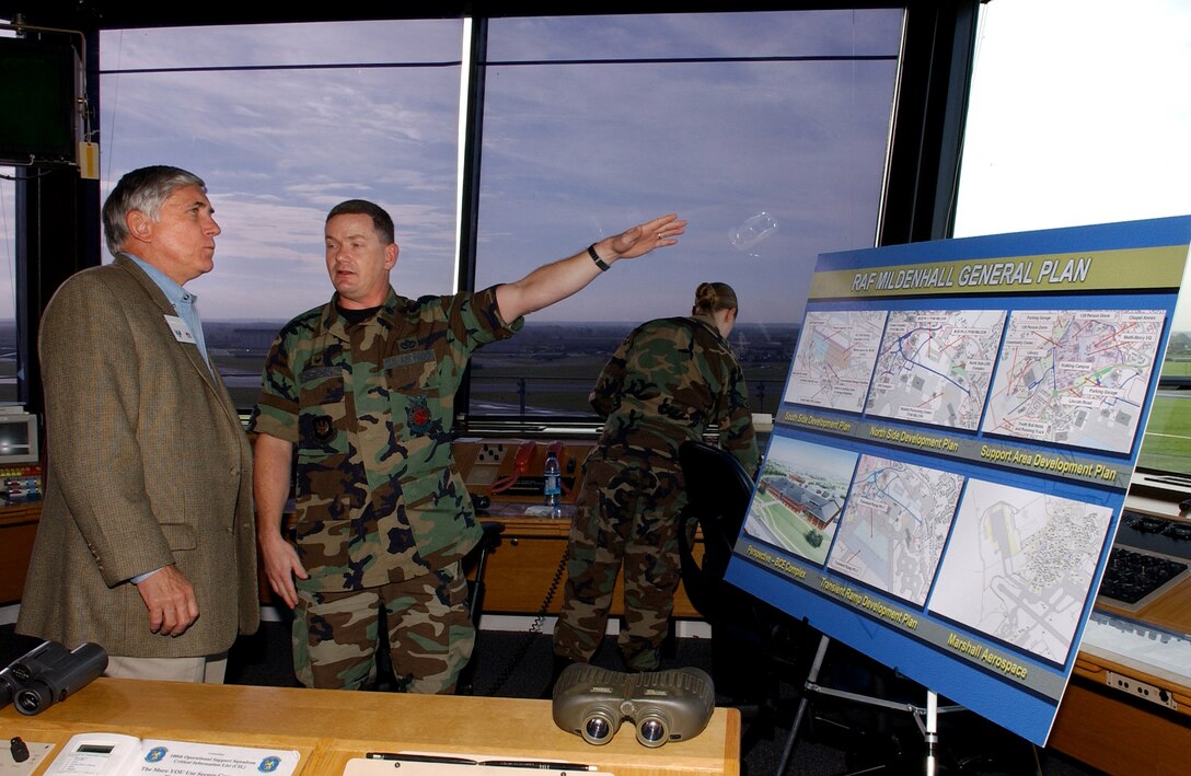 ROYAL AIR FORCE MILDENHALL, England - Lt. Col. Scott A. Hartford, 100th Civil Engineer Squadron commander, discusses plans for updating base facilities with Mr. Robert E. “Bob” Largent, chairman of the board, Air Force Sergeant’s Association, inside the air traffic control tower during his visit here, October 26, 2006. (US Air Force photo by Tech. Sgt. Jeanette Copeland)