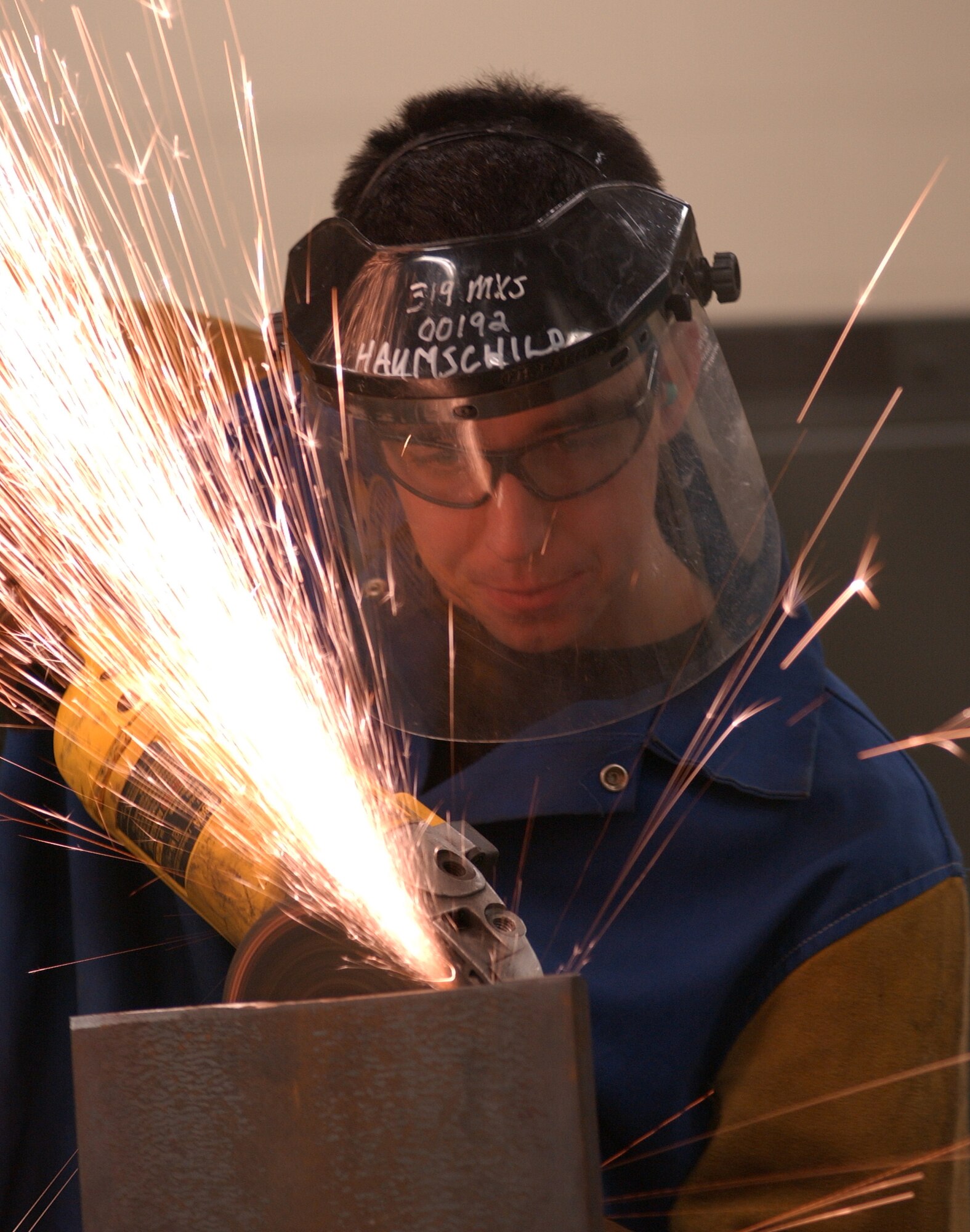 GRAND FORKS AFB, N.D. – Senior Airman Jake Schargus, a metals technology technician with the 319th Maintenance Squadron, finishes a piece of steel for a customer. Metals technicians not only make parts for the aging KC-135 as well as specialized tools for various customers. (photo/Airman 1st Class Ashley Coomes)