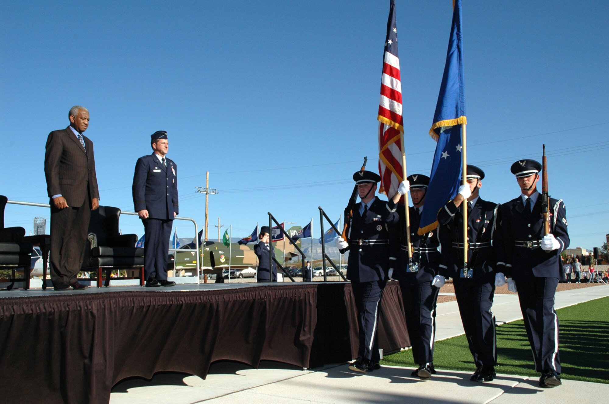 Brig. General Dave "Fingers" Goldfein and retired General Lloyd "Fig" Newton await the posting of the colors by the Holloman Honor Guard during the Silver Stealth celebration Oct. 27, 2006.
