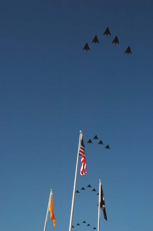 A large crowd watched as 25 F-117A aircraft pass over the flag pole at Heritage Park Oct. 27, 2006, for the Silver Stealth celebration at Holloman. The event was designed to celebrate the 25th year of the "hopeless diamond" and the 250,000 flying hour.