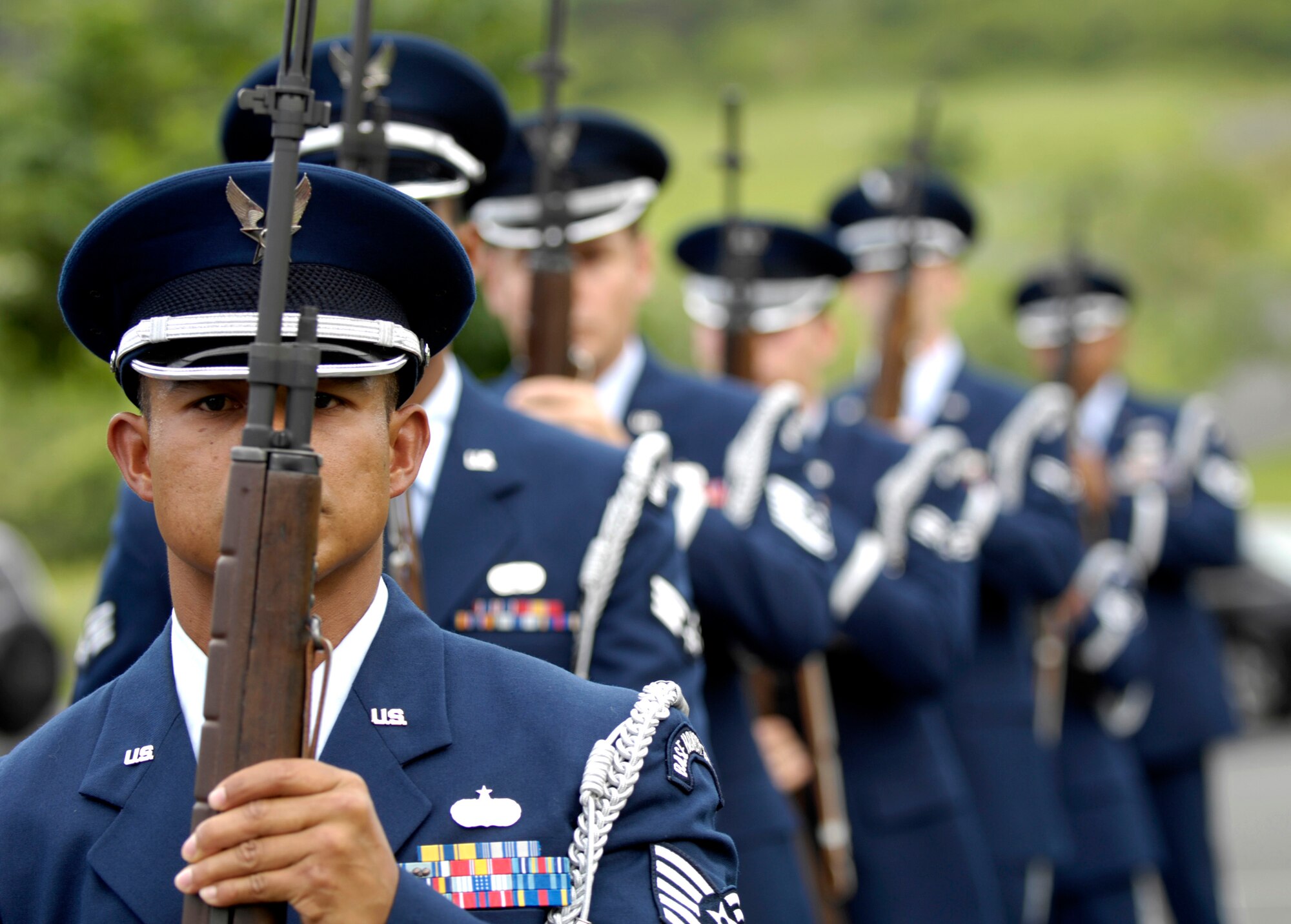 Members of the 15th Airlift Wing Honor Guard at Hickam Air Force Base, Hawaii, prepare to fire a volley Oct. 26 during a veteran's funeral at Hawaii Veterans Cemetery. The base honor guard is rendering military honors to the veteran and his family. (U.S. Air Force photo/ Tech. Sgt. Shane A. Cuomo) 