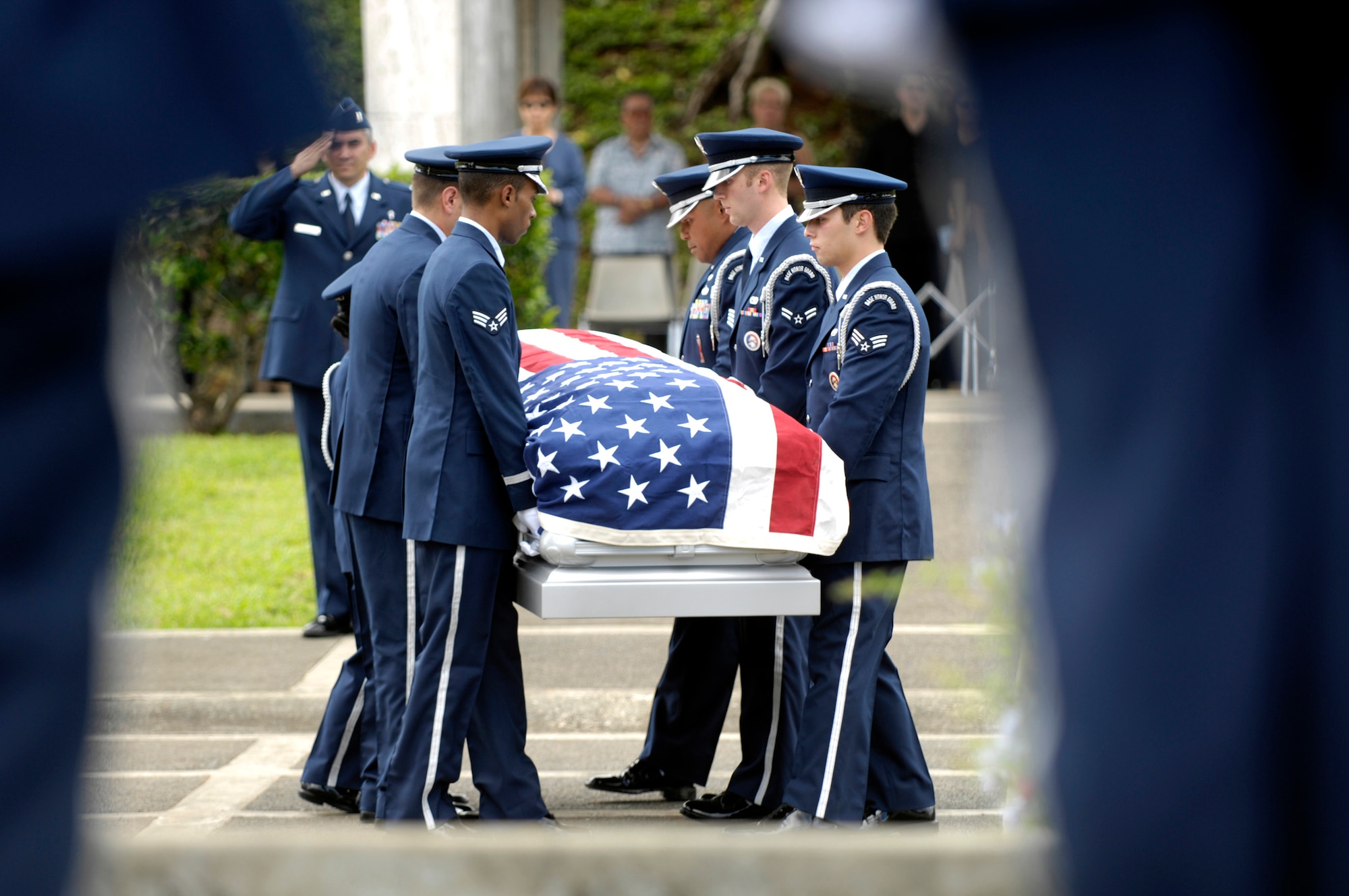 Members of the 15th Airlift Wing Honor Guard at Hickam Air Force Base, Hawaii, perform pallbearer duties Oct. 26 during a veteran's funeral at Hawaii Veterans Cemetery. The base honor guard is rendering military honors to the veteran and his family. (U.S. Air Force photo/ Tech. Sgt. Shane A. Cuomo)