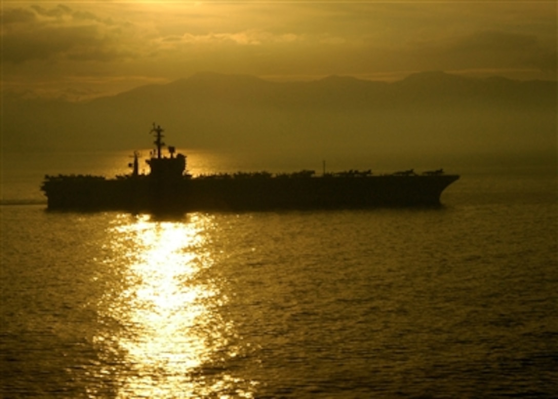 The Nimitz-class aircraft carrier USS Dwight D. Eisenhower gets under way after a four-day port visit in Naples, Italy, Oct. 21, 2006.