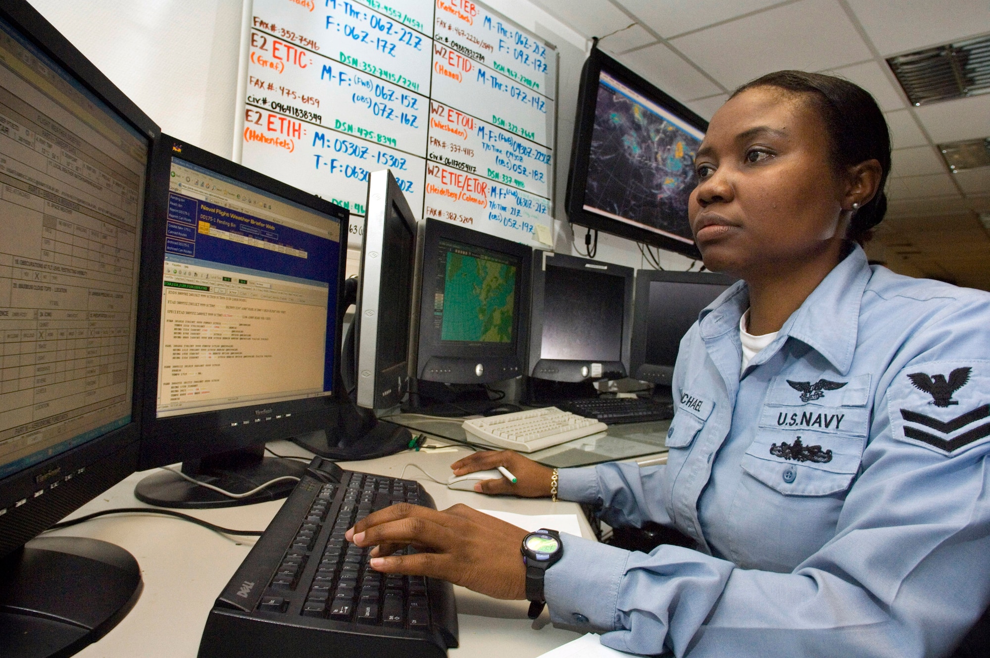 Aerographers Mate 2nd Class Evelyn Michael prepares weather briefs for aircrews throughout Europe from Sembach Air Base, Germany, Aug. 30. Petty Office Michael is one of the new Navy weather forecasters at Sembach's 20th Operational Weather Squadron. (U.S. Air Force photo/Master Sgt. John Lasky) 