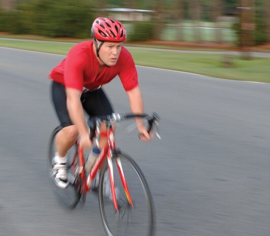 Maj. Richard Mathews, 437th Civil Engineer Squadron, cycles by in a blur. (U.S. Air Force photo by James Bowman) 
