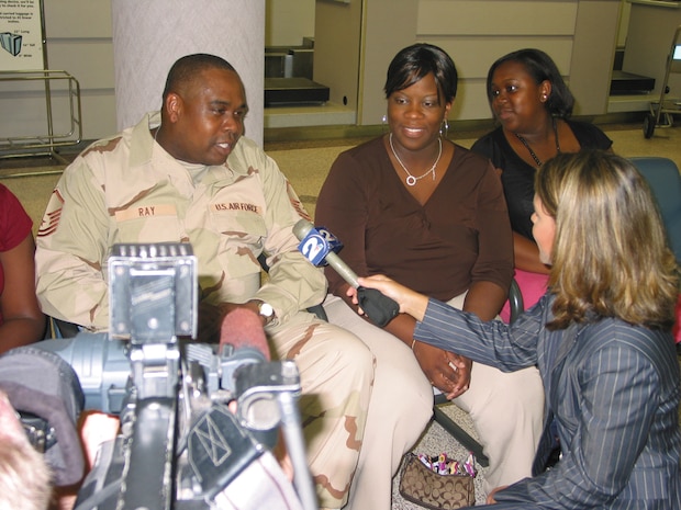 Master Sgt. Elliott Ray, 437th Operations Support Squadron superintendent of combat crew communications, his wife, Pamela, and daughter, Shaquitta, are interviewed by local media before his deployment with the 14 AS Sunday. (U.S. Air Force photo by Senior Airman Alice Moore) 

