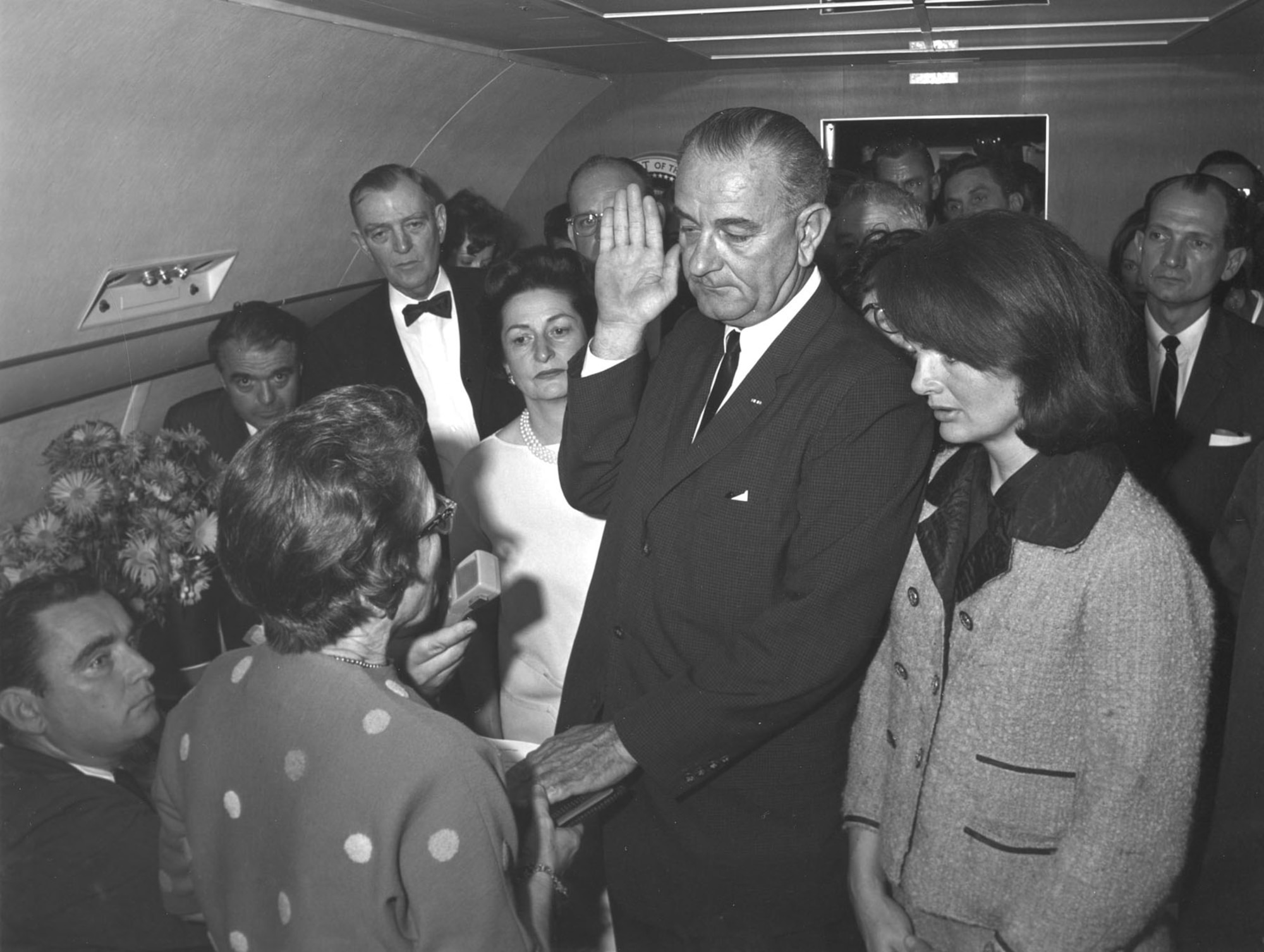 Lyndon B. Johnson takes the oath of office on board Air Force One (SAM 26000). Johnson became the 36th president of the United States following John F. Kennedy's assassination. (U.S. Air Force photo)