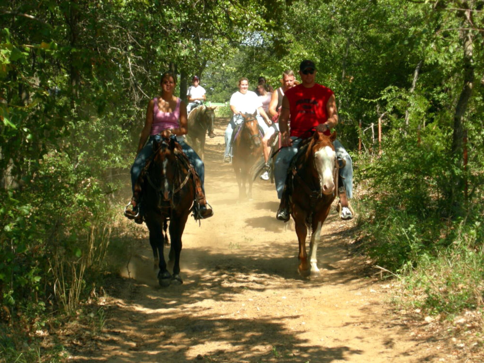 Military couples ride horseback at Jordan State Park in northern Denton County, Texas, Aug. 26.  The couples were at the park as part of Project Phoenix, which provides help to couples whose marriages are affected by combat deployments and their emotional aftermath. (Courtesy photo) 
