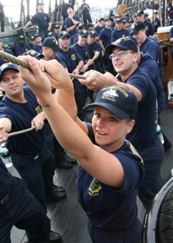 U.S. Navy Chief Petty Officer selectees heave on a line to set the jib aboard the USS Constitution during the second week of CPO leadership training aboard the ship in Boston, Mass., on Aug. 30, 2006.  Each year Old Ironsides hosts approximately 300 CPO selectees for training including sail handling, gun drill and community outreach designed to instill leadership and teamwork skills.  