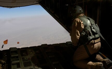 MSgt Gordy Heinen relaeses a dropsonde before an airdrop over Afghanistan Aug. 26, 2006.  The drop was made from almost 10,000 feet above mean sea level and provides up-to-the-minute wind data.  The dropsonds calculate wind speed and relay the information back to the aircraft, helping to find the correct drop point.  
(U.S. Air Force photo/Senior Airman Brian Ferguson)
 