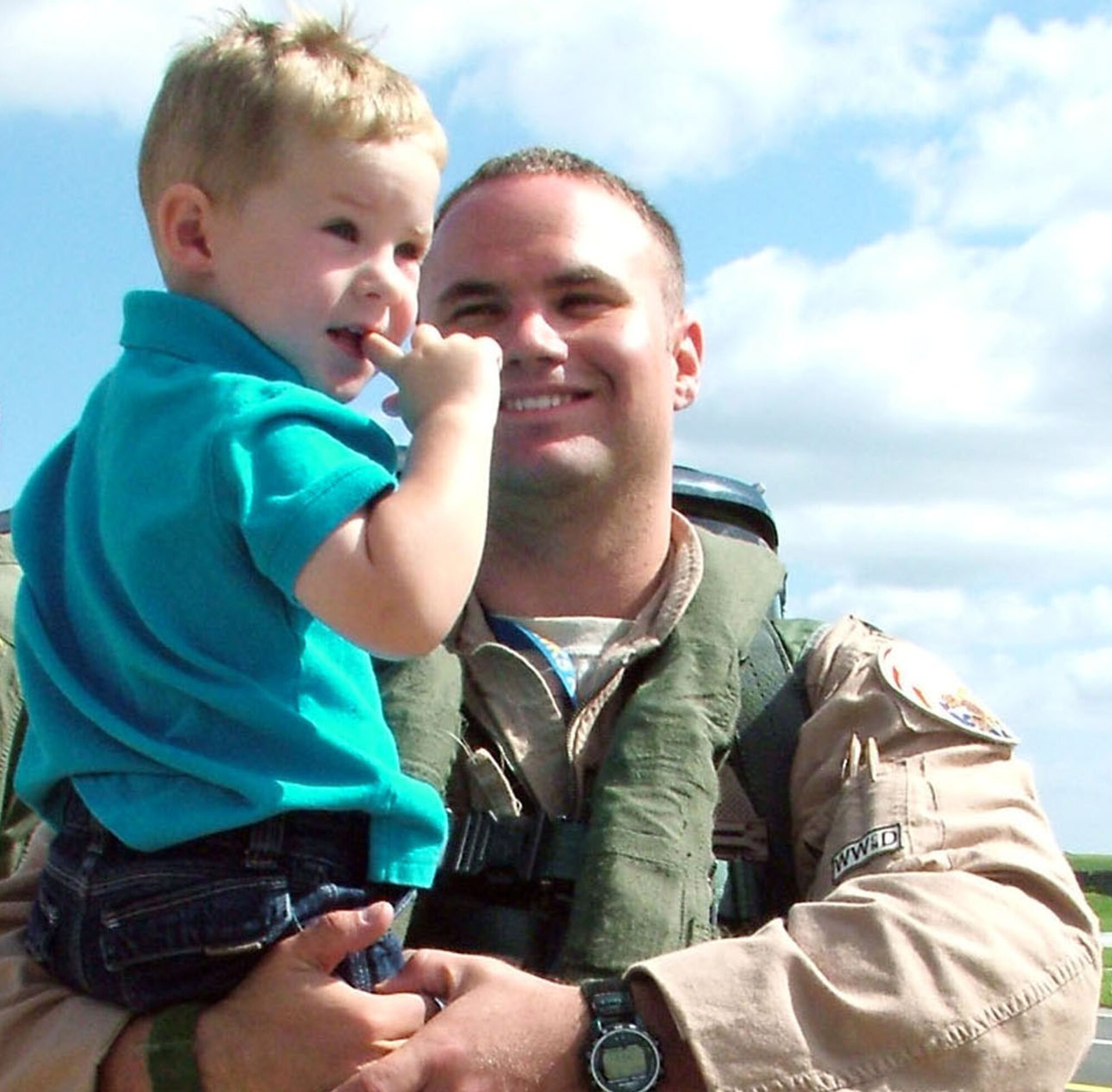 Capt. Matt Lande holds his 2-year-old son, Nick, after the captain arrived at Spangdahlem Air Base, Germany, on Labor Day. The F-16 Fighting Falcon pilot with the 23rd Fighter Squadron, was one of six pilots that returned home with their jets after a more than two month deployment to Southwest Asia. It was the captain's first deployment. The unit provided close-air support to coalition forces in Iraq and Afghanistan. The flight back home took eight hours. The rest of the squadron will return home in the next week. 
(U.S. Air Force photo/ Senior Airman Eydie Sakura)