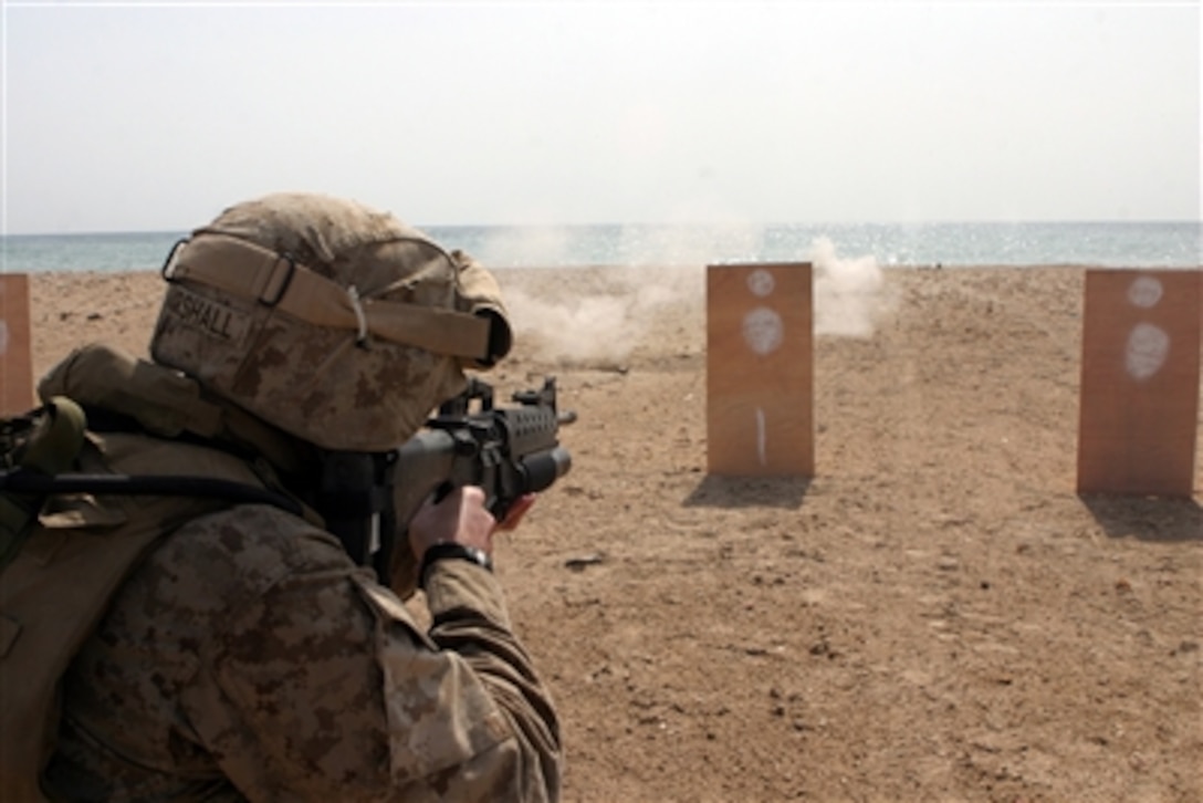 Marines serving with the 24th Marine Expeditionary Unit's (Special Operations Capable) MEU Service Support Group 24 participate in an enhanced marksmanship program and crew-served weapon live-fire range while training in Dijibouti, Africa, Aug. 26, 2006. 