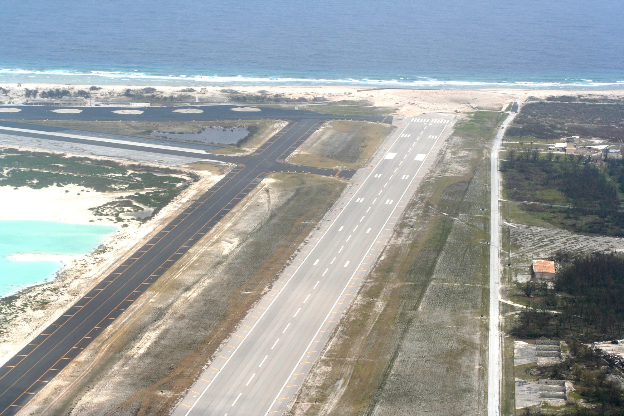 A Coast Guard flyover of Wake Island Sept. 2 shows little apparent damage from Super Typhoon Ioke around the runway and taxiway, officials said. (U.S. Coast Guard photo)
