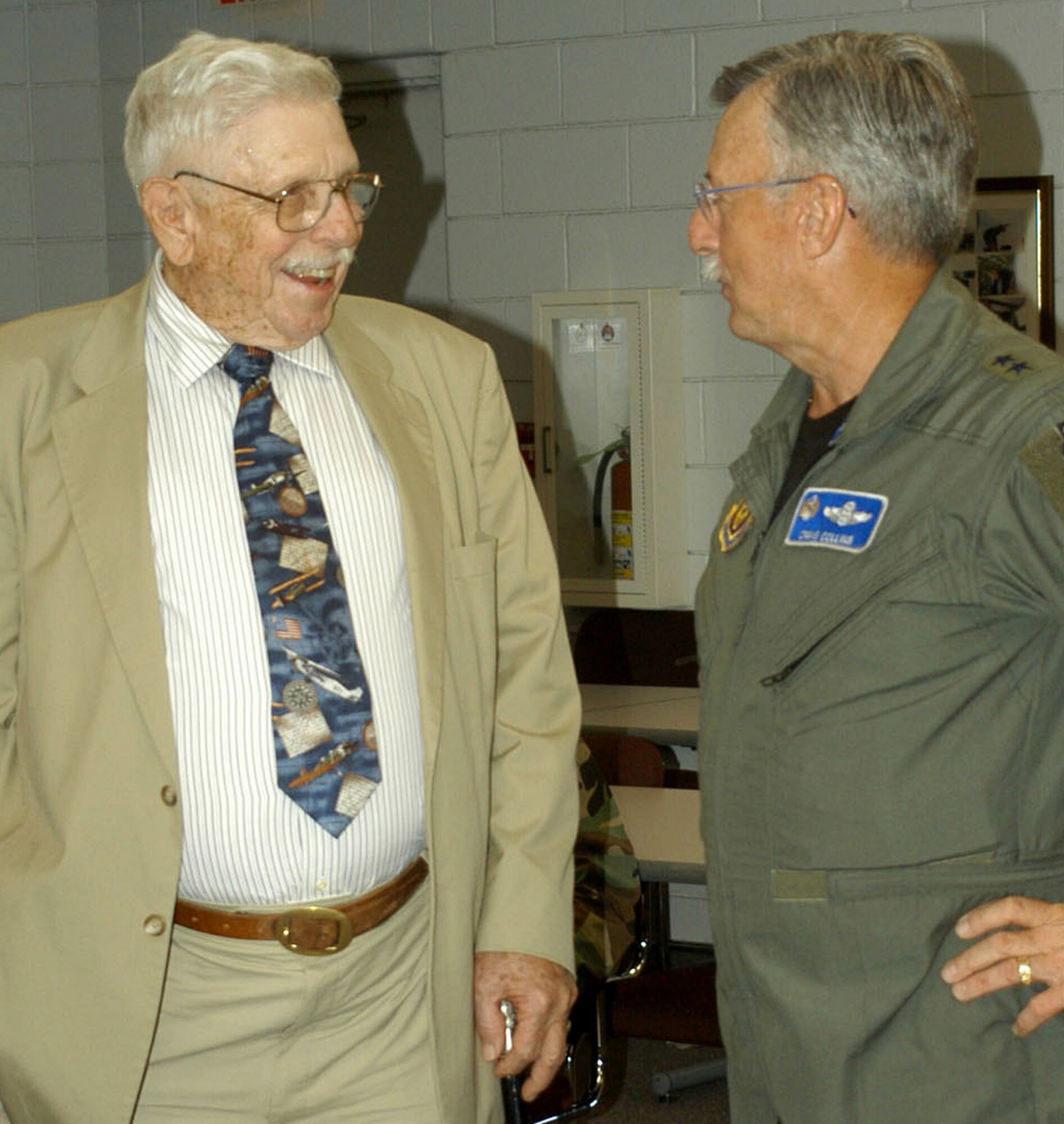 Maj. Gen. (ret.) Homer Lewis reminisces with 10th Air Force Commander, Maj. Gen. Craig Collins, following a Reserve Officer's Association luncheon held recently here. (U.S. Air Force Photo/Staff Sgt. Kristin Mack)
