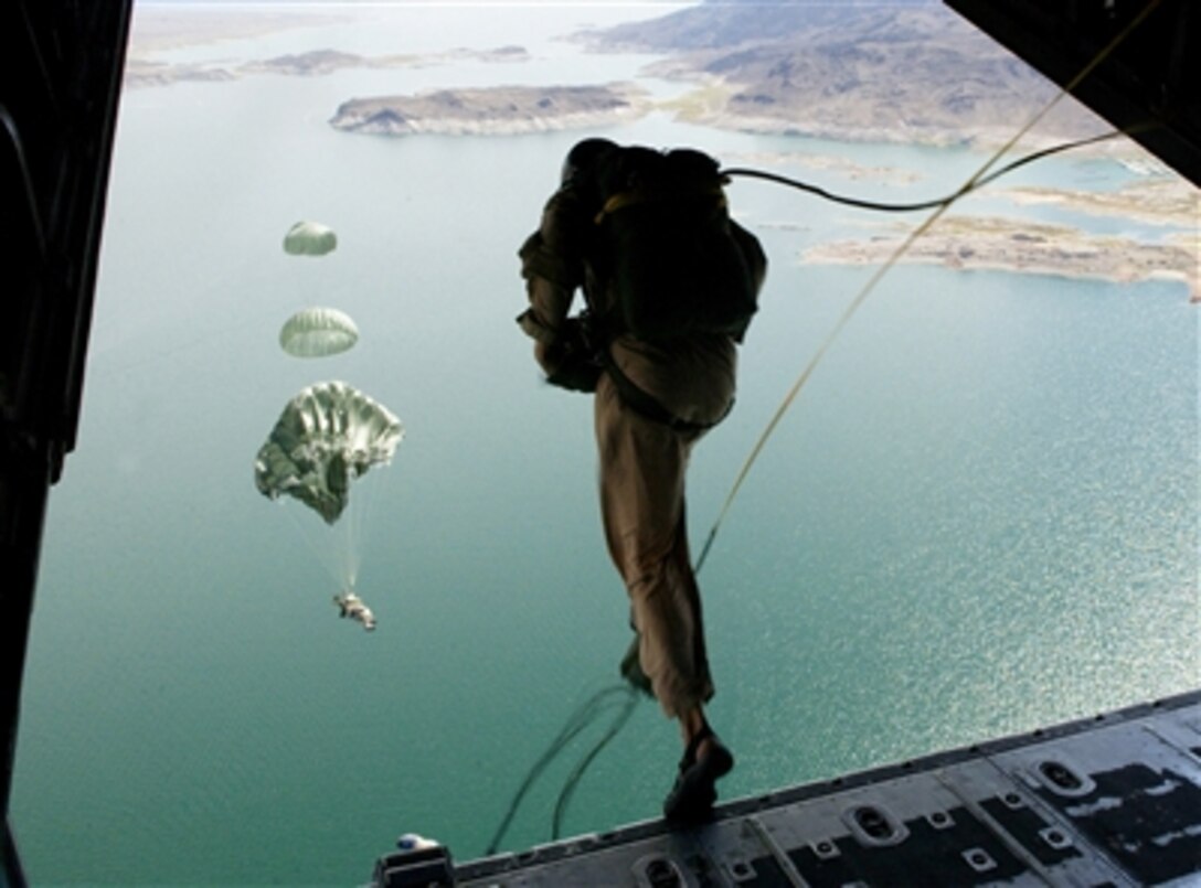 U.S. Air Force pararescuemen and combat controllers jump from a C-130J Hercules aircraft over Lake Mead during exercise Red Flag 06-2 on Sept. 1, 2006.  The pararescuemen are attached to the 58th Rescue Squadron the 414th Combat Training Squadron, Nellis Air Force Base, Nev.  