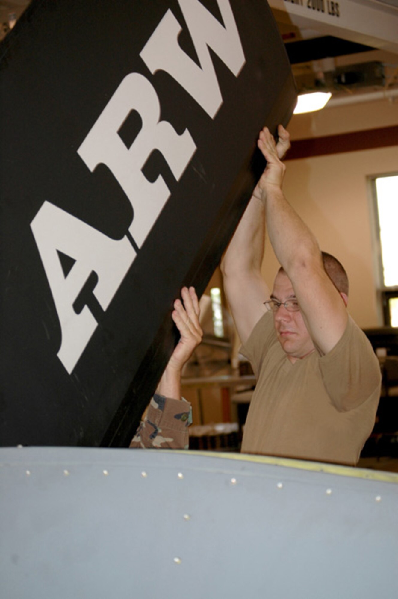 GRISSOM AIR RESERVE BASE, Ind -- Senior Airman Nick Garman, 434th Aircraft Maintenance Squadron, removes the rudevator from a KC-135R boom during a unit training assembly. Airman Garman and other maintainers were performing scheduled  phase inspection on a Grissom Stratotanker. (U.S. Air Force photo/Tech. Sgt. Doug Hays)