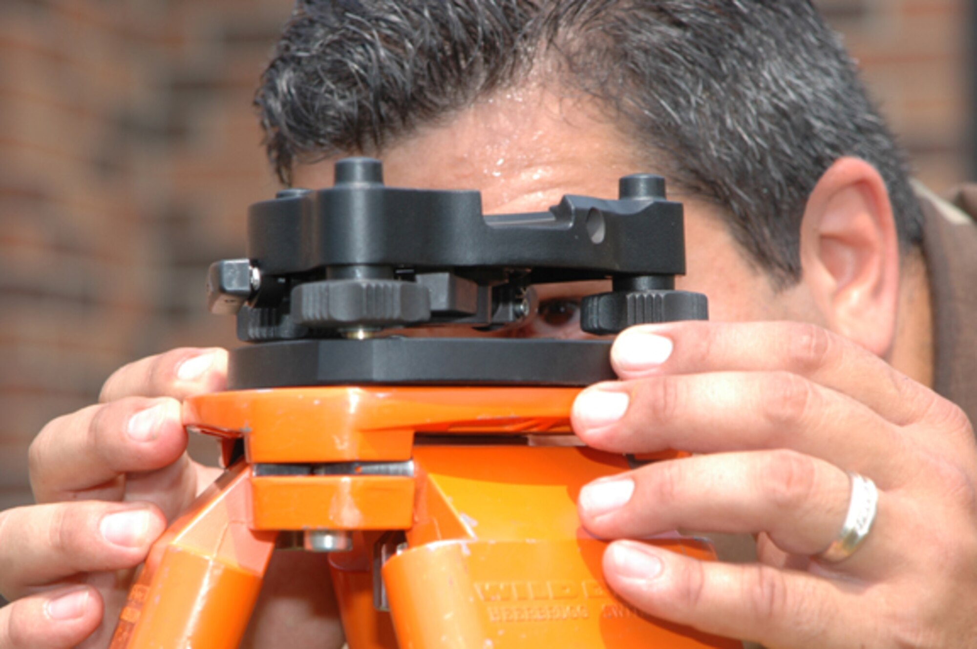 GRISSOM AIR RESERVE BASE, Ind -- Staff Sgt. Antonio Acevedo, an engineering apprentice with the 434th Civil Engineering Squadron, ensures his geodimeter is leveled. The geodimeter helps CES establish the elevation of other points based off a known point. The geodimeter sends a laser to target areas that are made up of prisms set on tripods. The geodimeter sends a laser shot to the prism which is then bounced off the prism back to the geodimeter, where it is calculated. (U.S. Air Force photo/ SrA. Roberto Modelo)