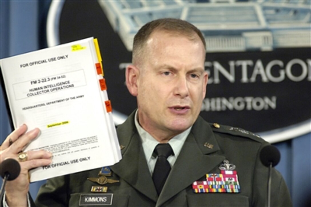 Lt. Gen. John Kimmons, U.S. Army, holds up a copy of the Army Field Manual, FM 2-22.3, Human Intelligence Collector Operations as he briefs reporters on the details of the manual in the Pentagon on Sept. 6, 2006.  The manual details guidelines for the interrogation of detainees in U.S. military custody.  Kimmons joined Assistant Secretary of Defense for Detainee Affairs Cully Stimson, who discussed the newly adopted Department of Defense Directive 2310.01E, which is the principal document within the department dealing with all aspects of the detainee program.  