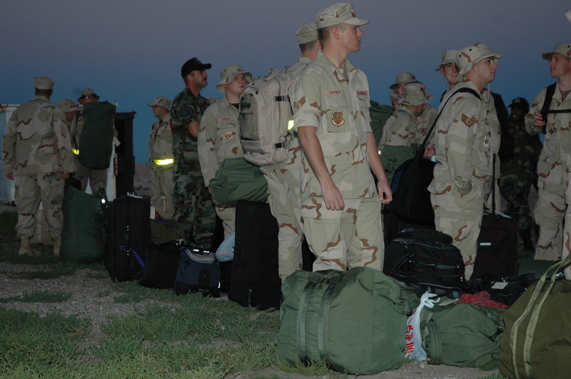 Airmen wait to board their aircraft before deploying to Southwest Asia from Ellsworth Air Force Base, S.D., in September. More than 500 base Airmen left to support operations in Iraq and Afghanistan. (U.S. Air Force photo/Airman Nathan Riley)