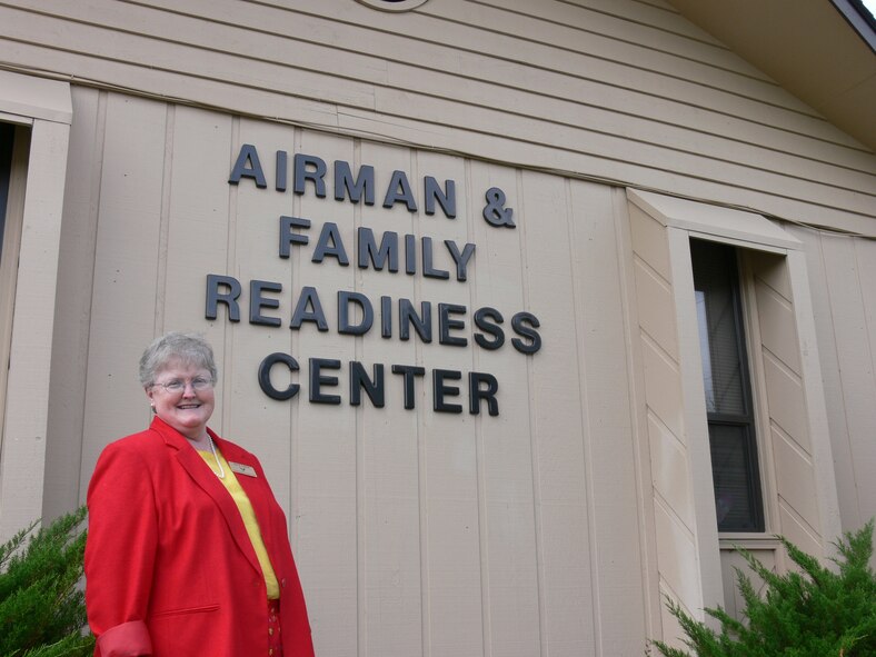 Ann Lukens, Airman and Family Readiness Center flight chief, shows off the flight’s new name, which changed from the Family Support Center. The flight is celebrating its 25th anniversary at 1:30 p.m. Thursday at the AFRF center.  (U.S. Air Force Photo by Airman 1st Class Eric Schloeffel) 