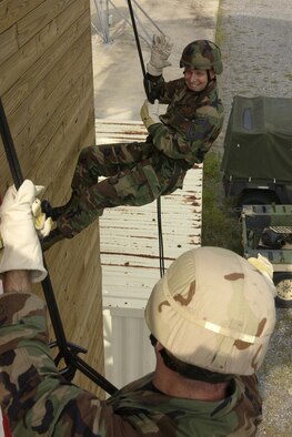 Chief Master Sgt. Dennis Vannorsdall, 820th Security Forces Group, takes his re-enlistment oath during the grand opening of the 347th Rescue Wing’s rappel and fast rope tower. A confidence course was also built to provide a training opportunity, which can used with prior approval from the 820th SFG training section.