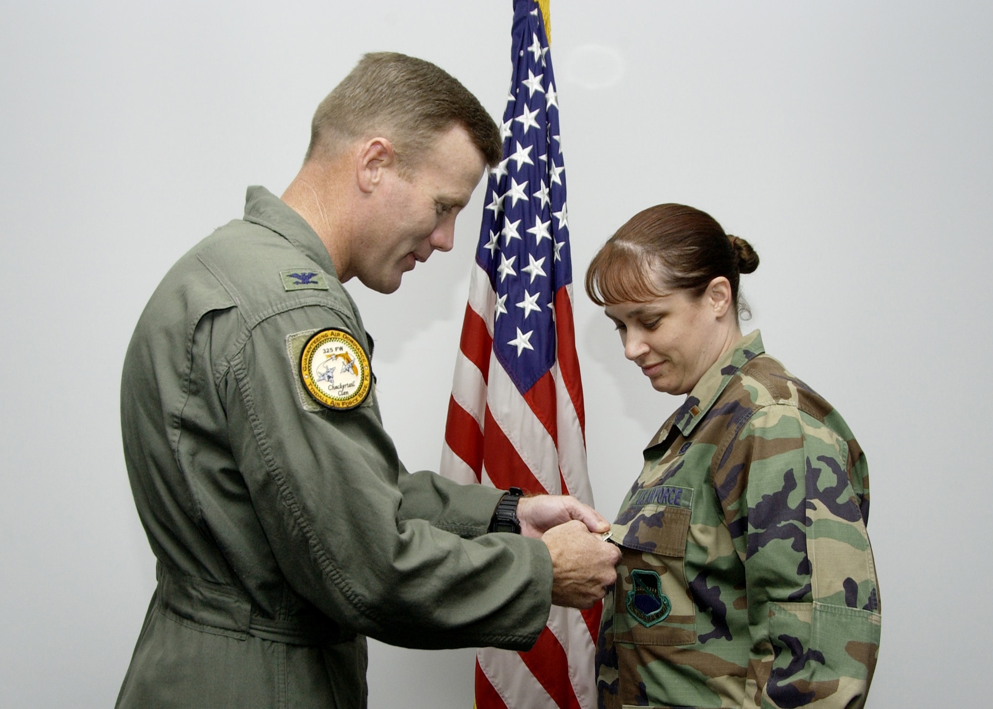 Col. Tod Wolters, 325th Fighter Wing commander, pins the Airman’s Medal on Lieutenant Bancroft during a ceremony Tuesday. (U.S. Air Force Photo by Isaac Gibson)