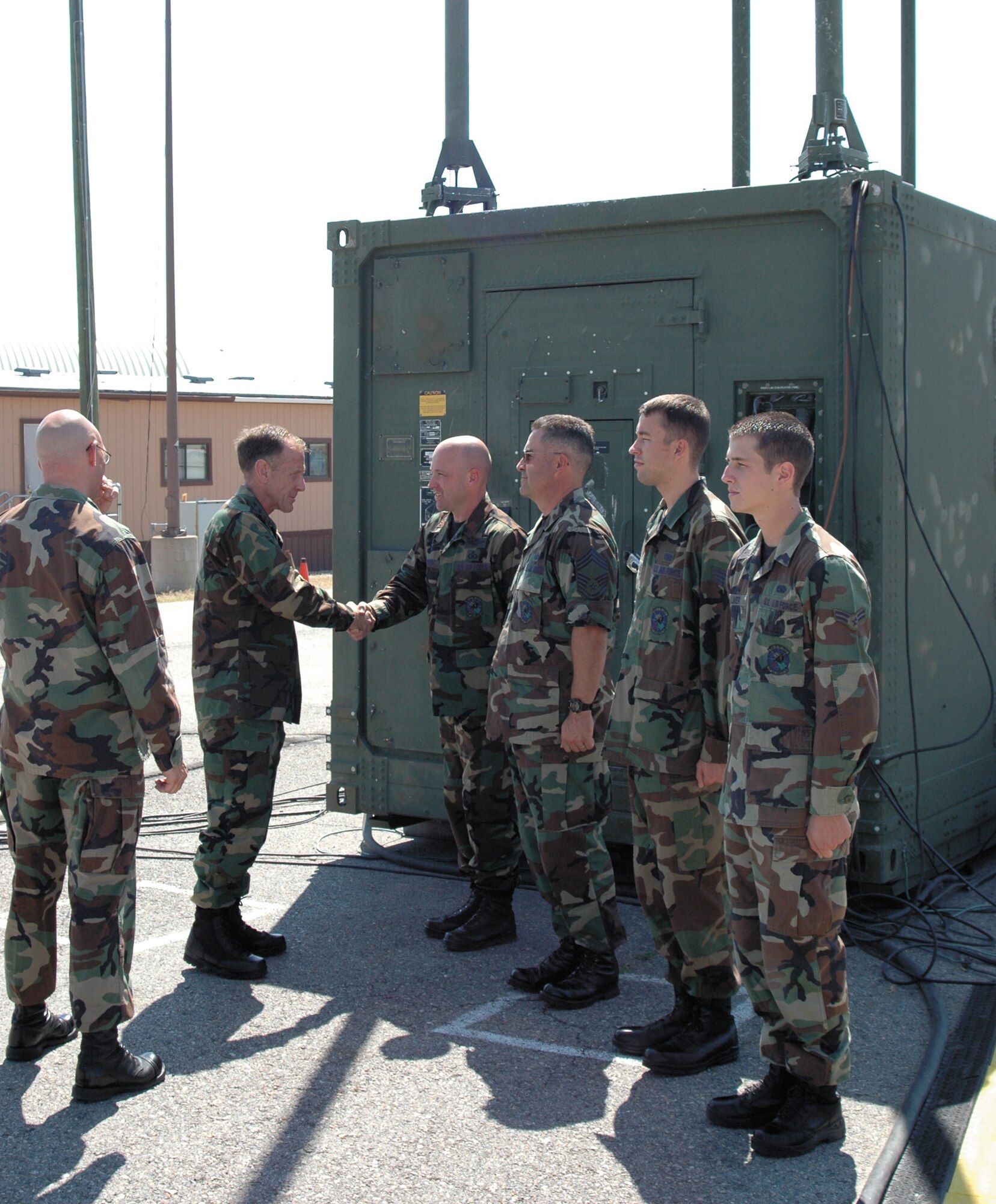 Lt. Gen. Norman Seip, 12th Air Force and Air Forces Southern commander, shakes hands with members of the 729th Air Control Squadron as they introduced him to their operations module.