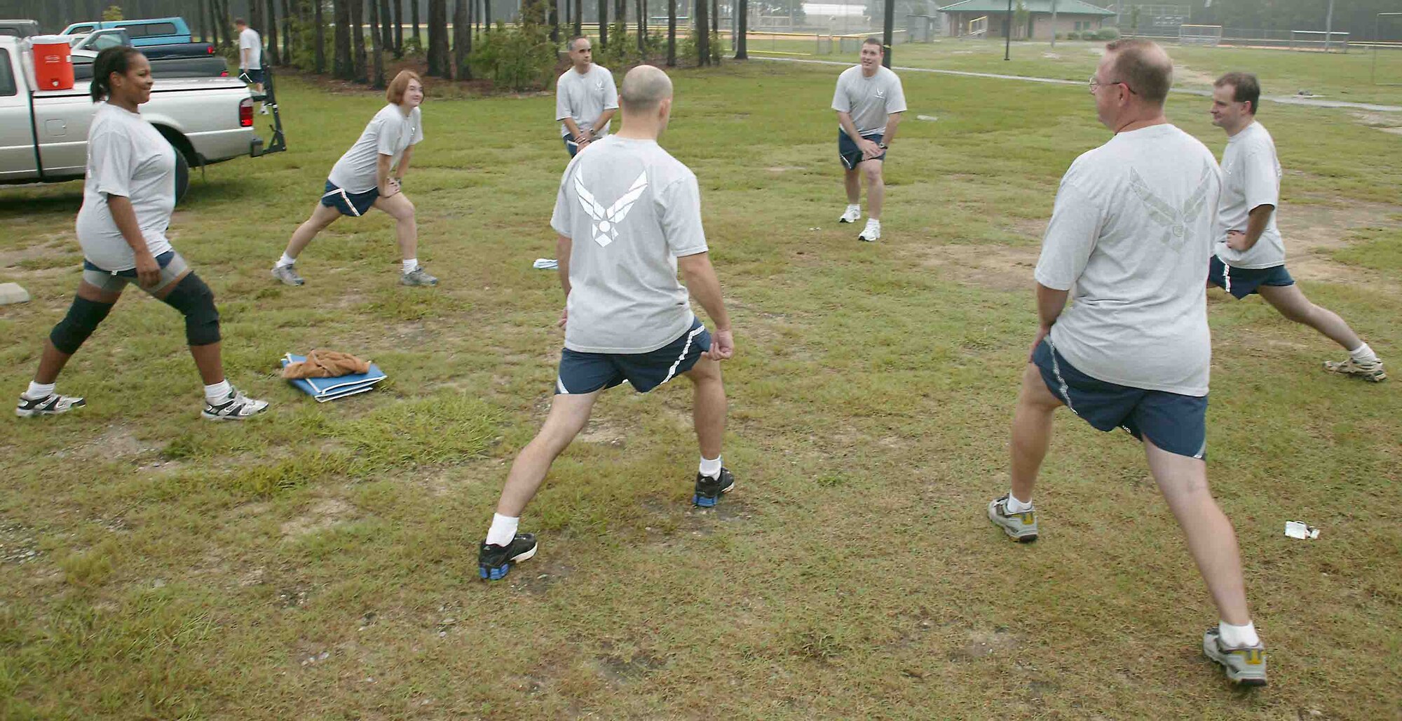 SHAW AIR FORCE BASE, S.C.-- Members from the 609th Air Intelligence Group stretch prior to a workout Wednesday at the outdoor recreation sports complex. PT wear is mandatory during unit physical training after Sept. 30. (U.S. Air Force photo/Senior Airman John Gordinier)
