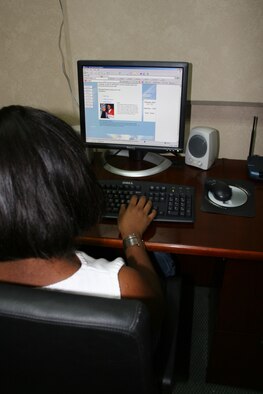 A  base member uses MySpace to communicate with family and friends back home. MySpace can be a very useful communication tool; however, when not used safely, it can cause problems. (U.S. Air Force photo by Staff Sgt. Oshawn Jefferson)