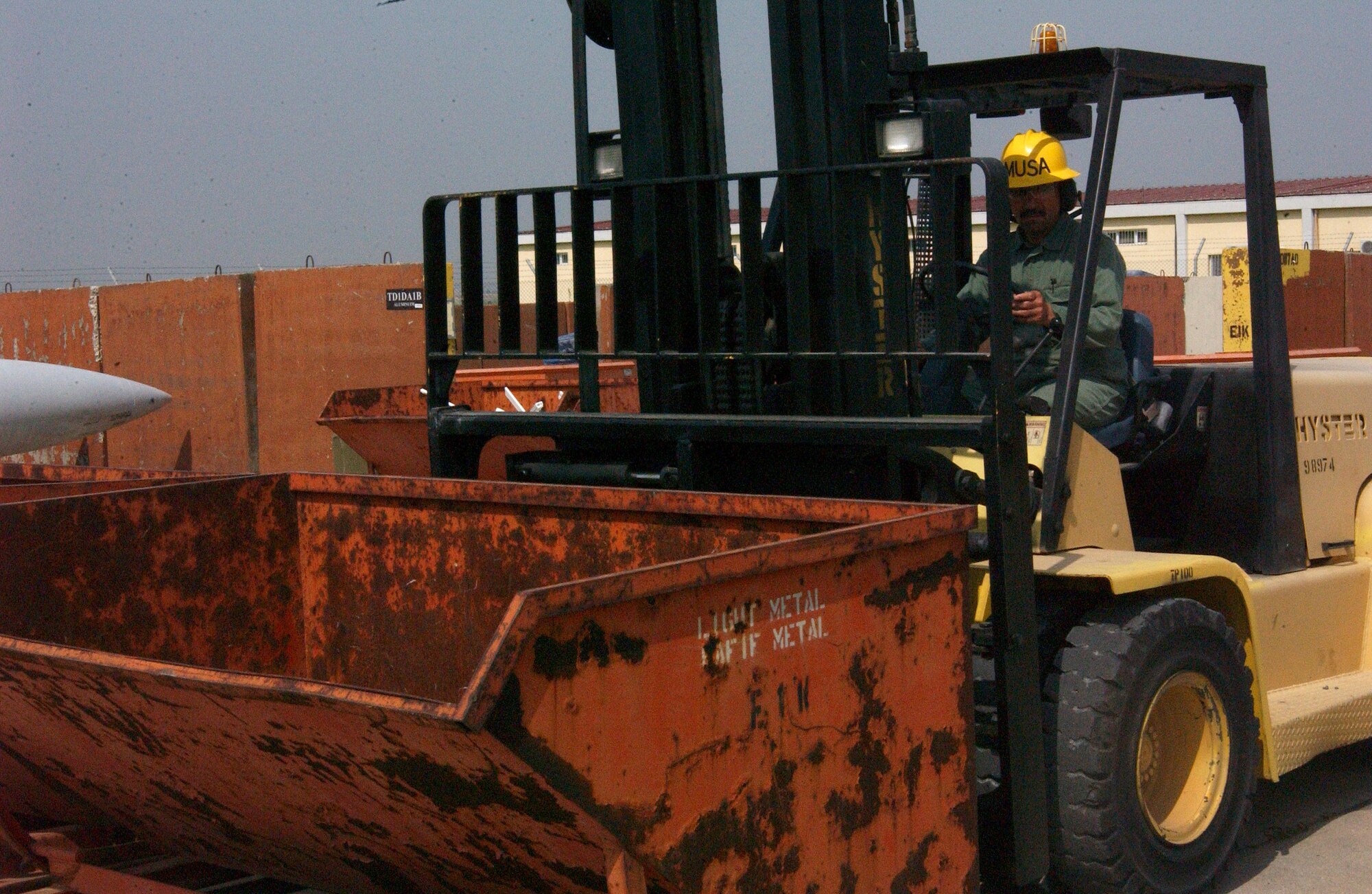 Musa Sinim, a fork lift driver for Defense Reutilization and Marketing Office, helps move equipment around. (U.S. Air Force photo by Airman 1st Class Nathan Lipscomb)